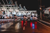 cars on road near station during night