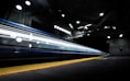 timelapse photography of train passing on track