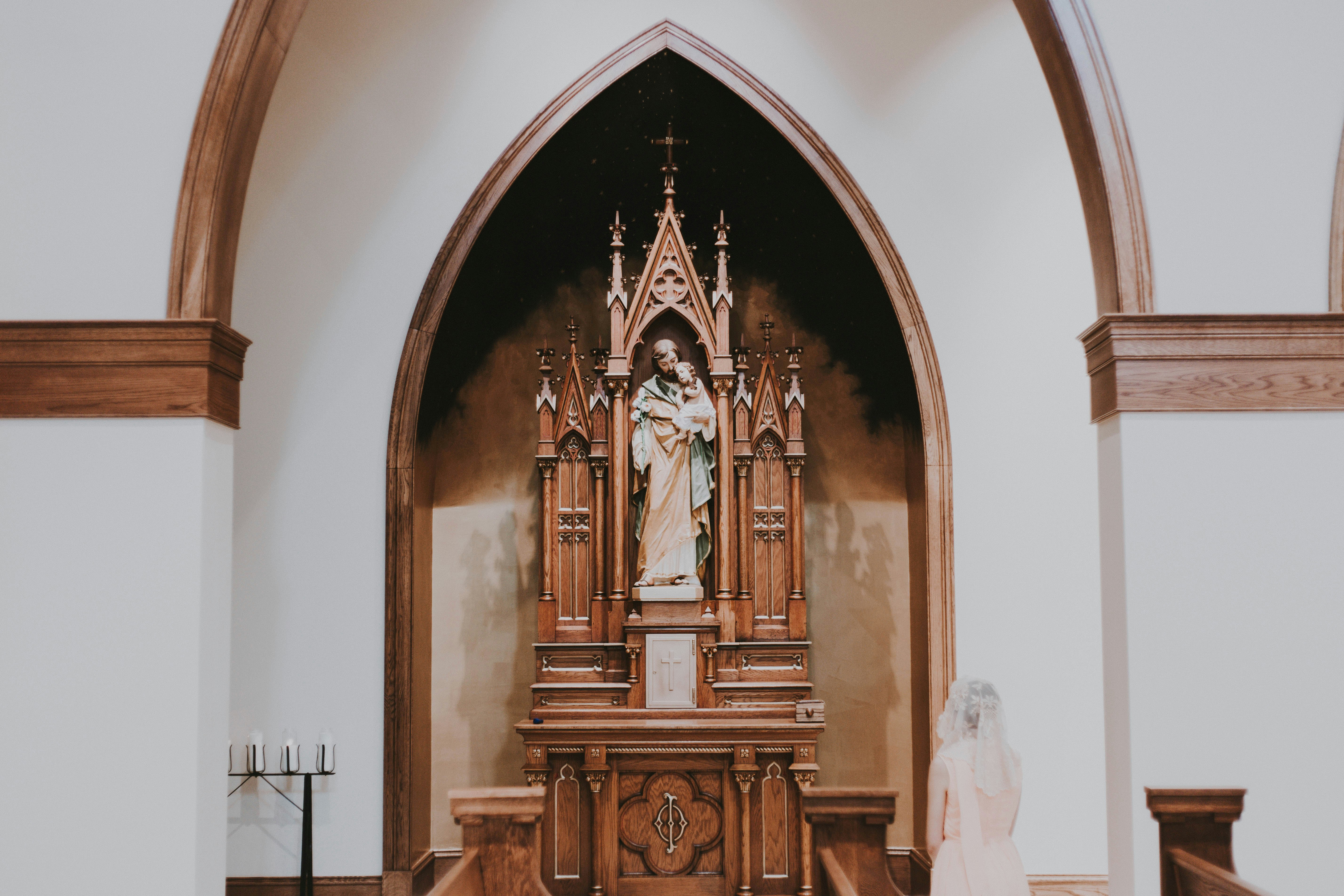 woman wearing yellow long-sleeved dress under white clouds and blue sky during daytime