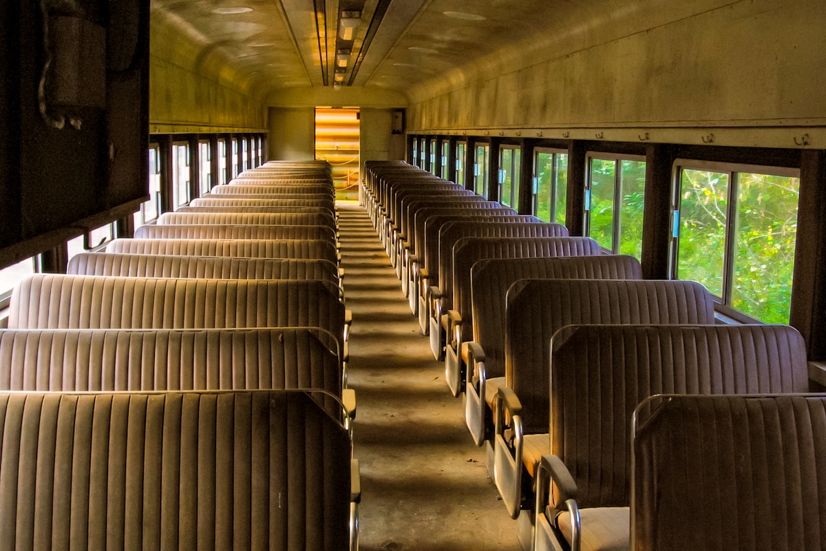 Rows of passenger seats inside a bus cabin