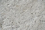 Close-up of smooth, freshly poured concrete surface ready for finishing.