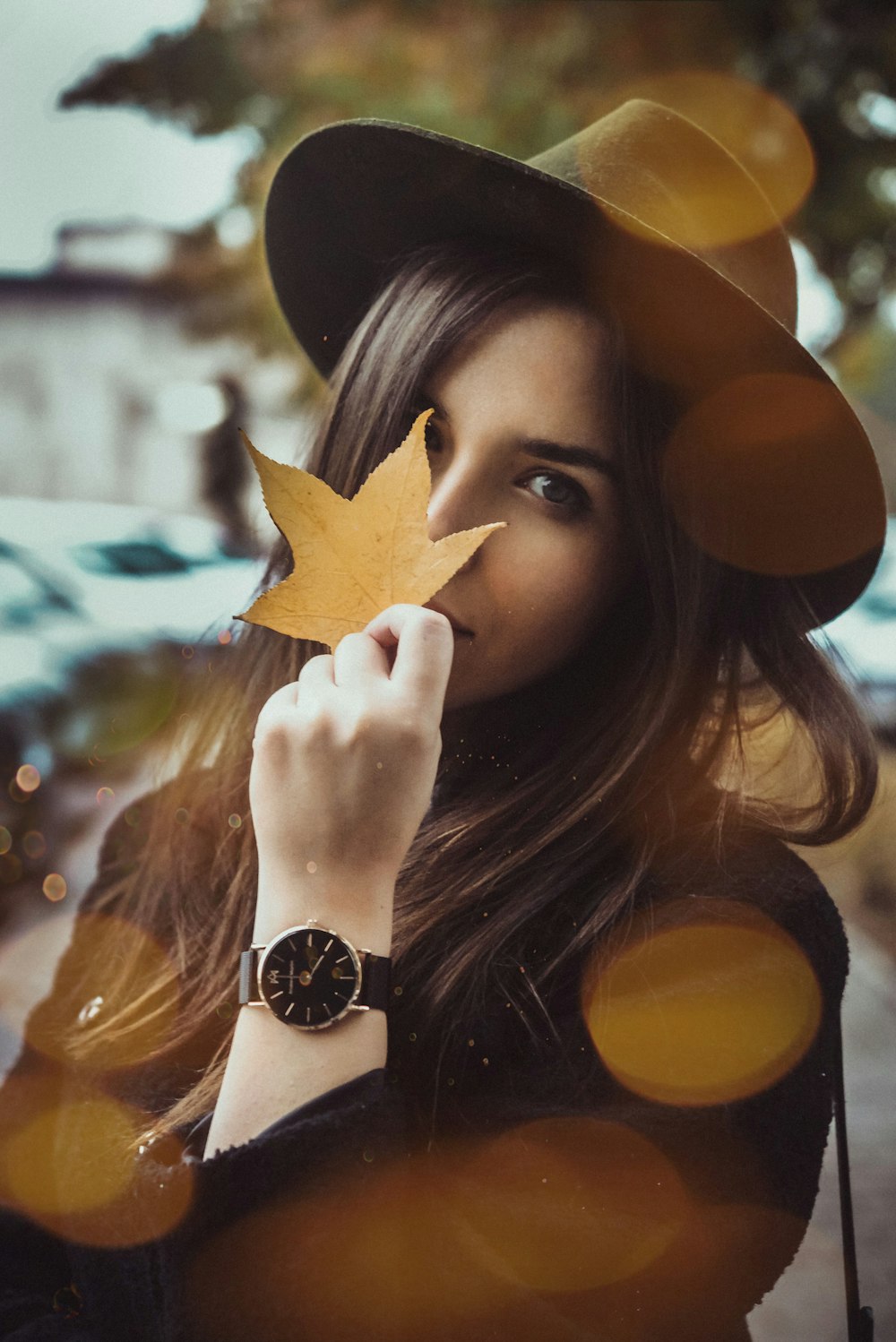 woman holding dry leave