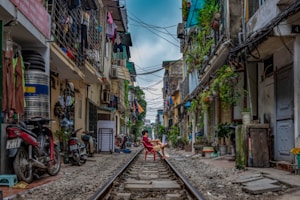 man sitting on railway
