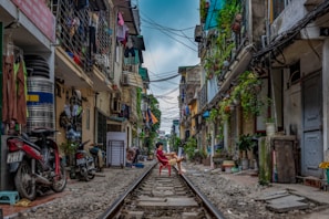 man sitting on railway