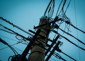 low angle photography of utility tower