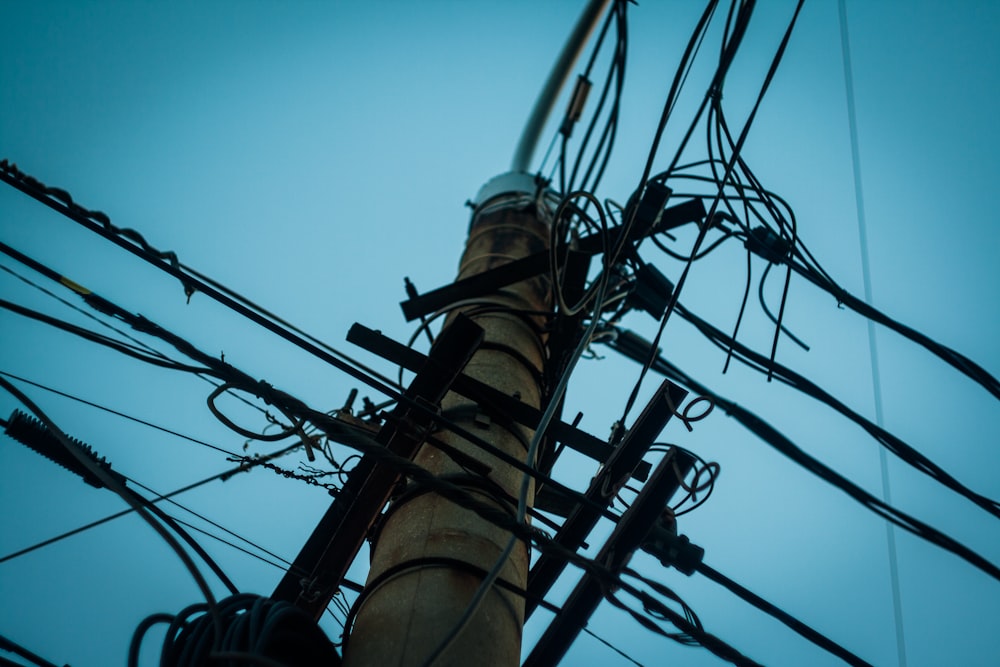 low angle photography of utility tower