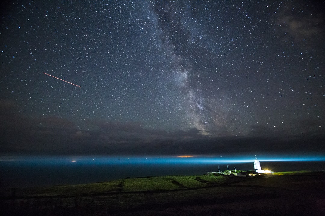 farm field near sea during nighttime