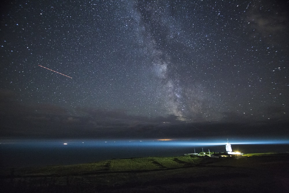 farm field near sea during nighttime