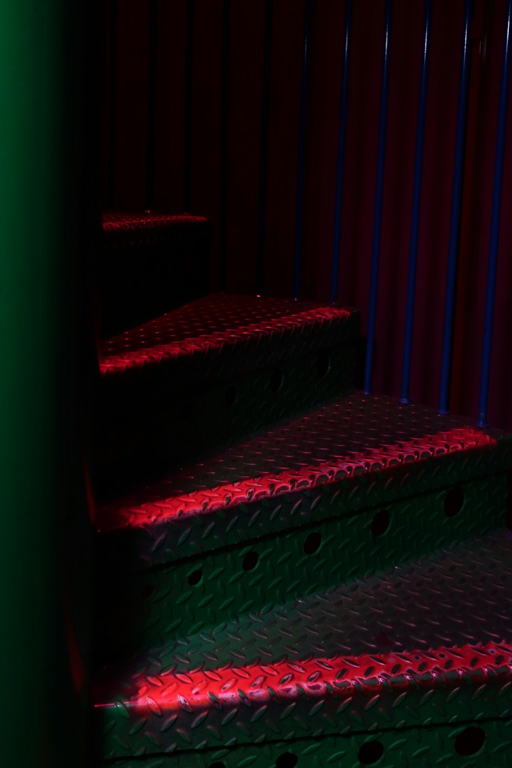 a set of stairs lit up with red and blue lights