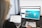 woman sitting in front of turned-on computer monitor