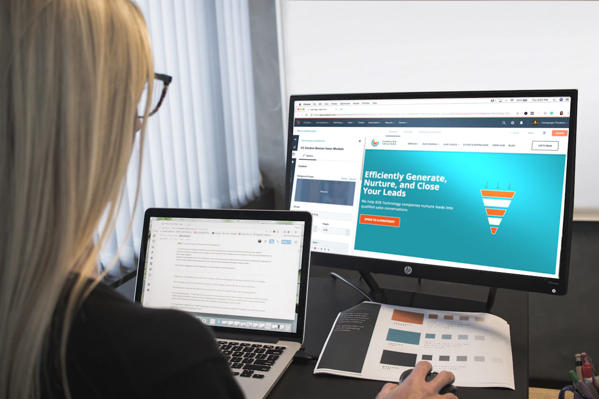 Website specialist reviewing a professional business website on desktop screens