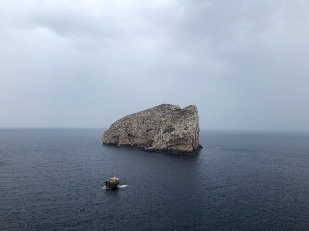 rock formation on body of water