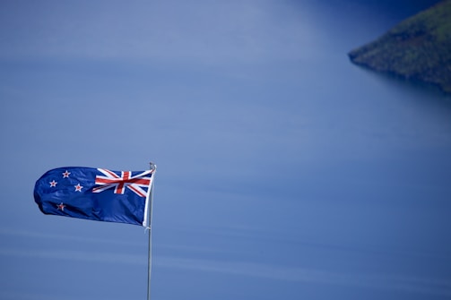 A split image showing Germany and New Zealand landscapes symbolizing transnational perspective.