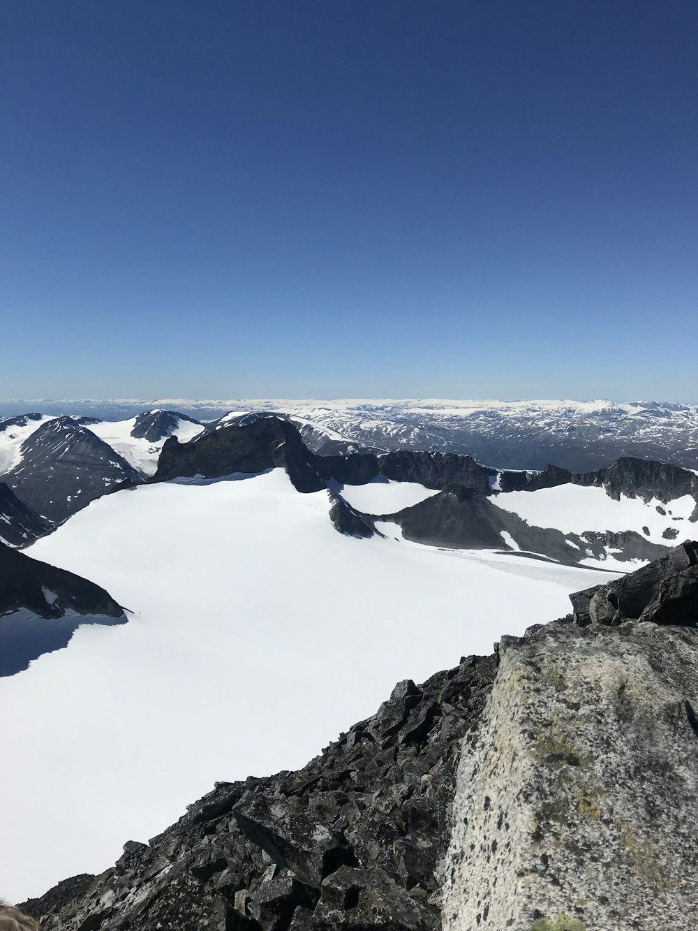 gray rocky mountain under clear blue sky during daytime