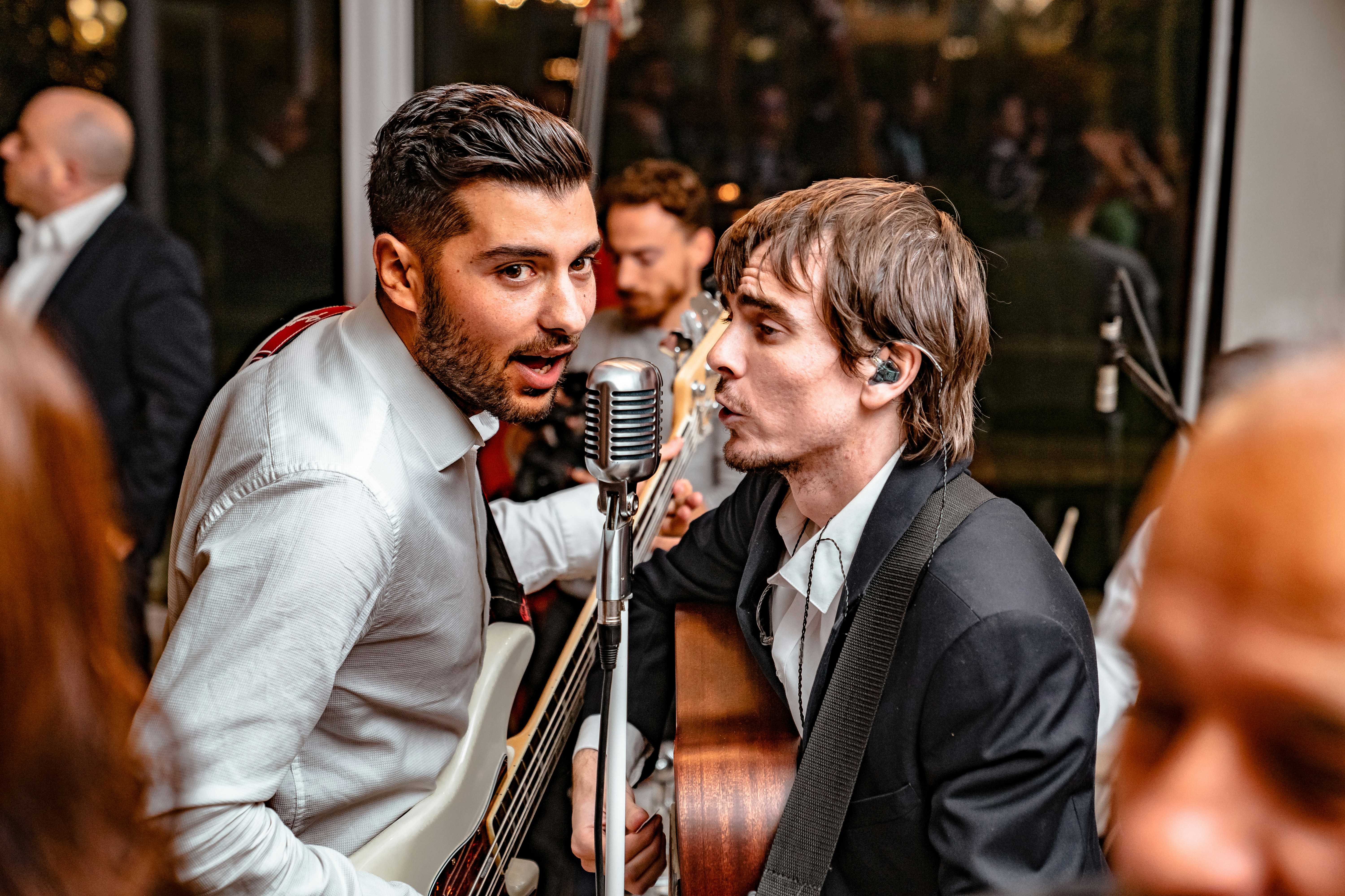 men playing guitar and singing