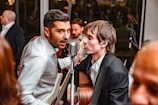 men playing guitar and singing