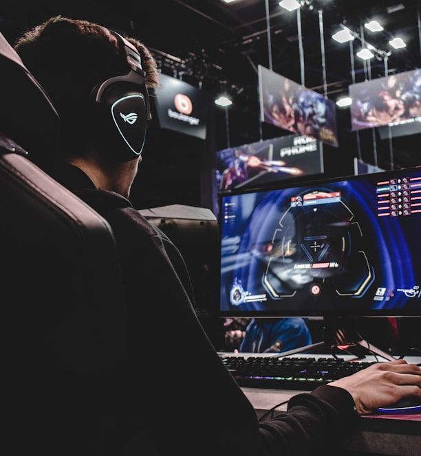 person sitting on gaming chair while playing video game