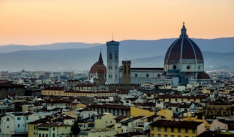 A panoramic view of Murcia city with the Cathedral and Segura River at sunset.
