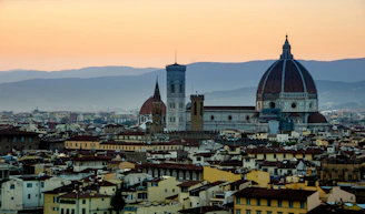 A panoramic view of Puebla's colonial cityscape at sunset.