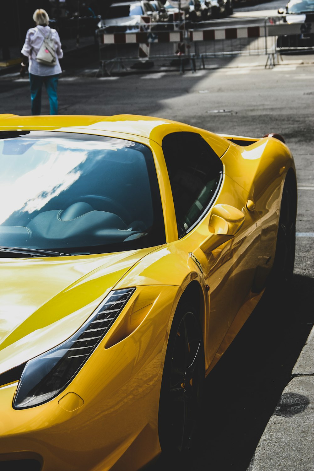 yellow Ferrari 458 Italia on road