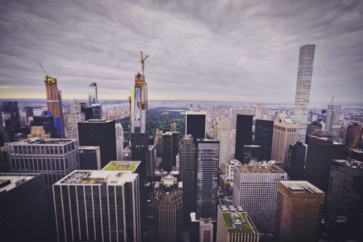 A panoramic view of a sprawling IT park under construction with cranes and modern buildings.