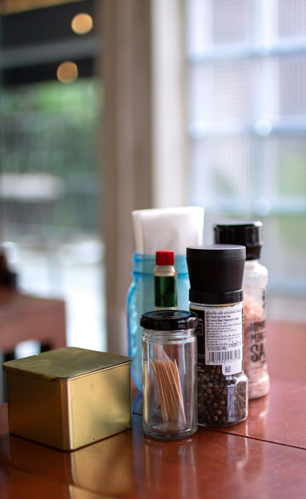 bokeh photography of condiment shakers