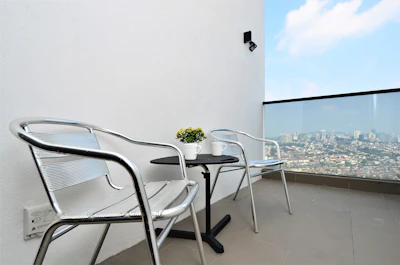 A compact metal folding table perfect for small balconies.