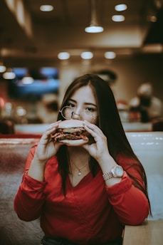 woman eating burger