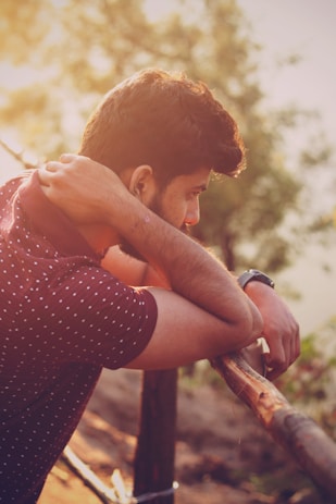 man wearing maroon polo shirt