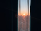 A scenic view of a sunrise seen through a window, inspiring new ideas.