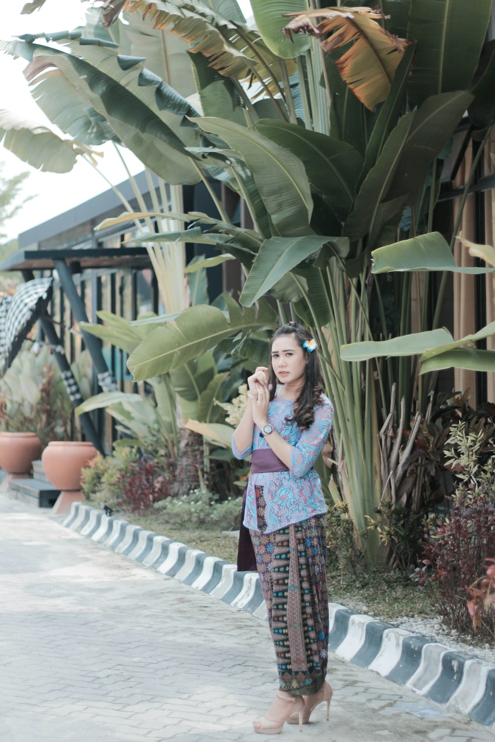 woman standing near banana plant