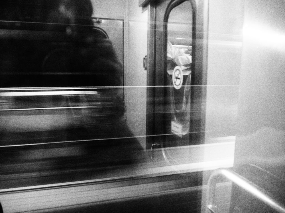 a black and white photo of a subway train