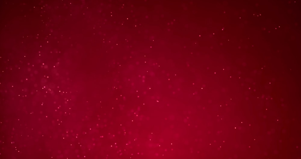 a red background with snow flakes on it