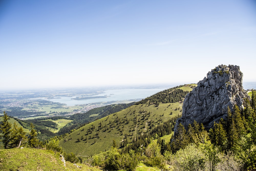 a view of a mountain range with a lake in the distance