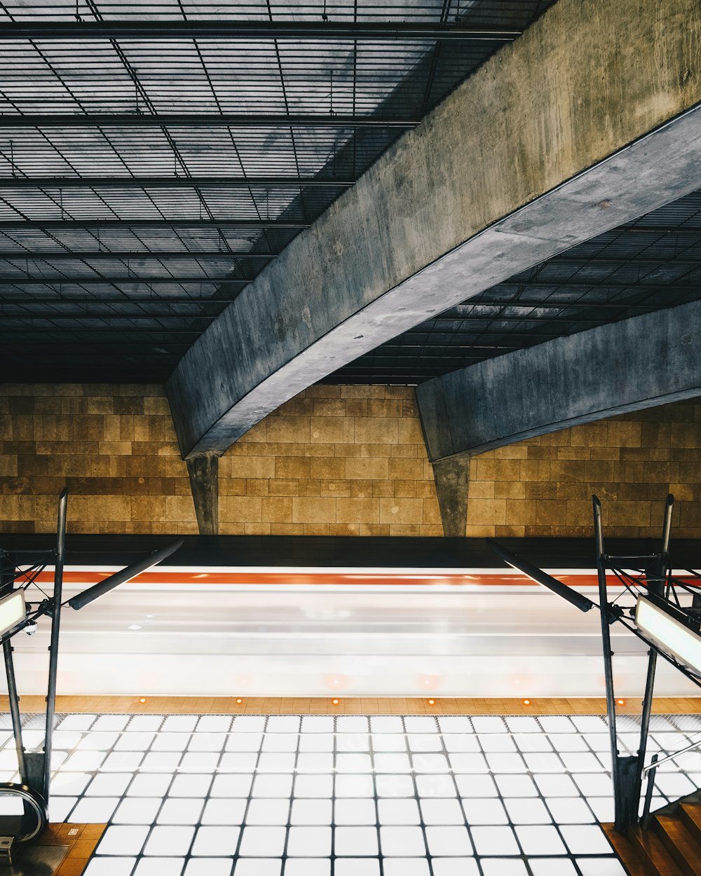 a skateboarder is riding down a ramp in a skate park