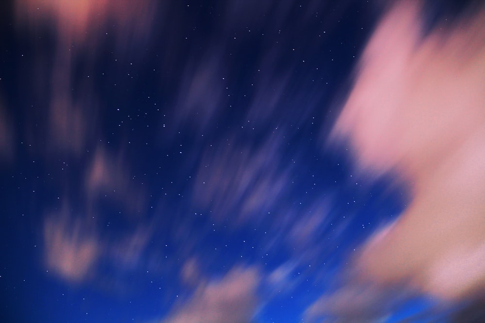 the night sky is full of stars and clouds