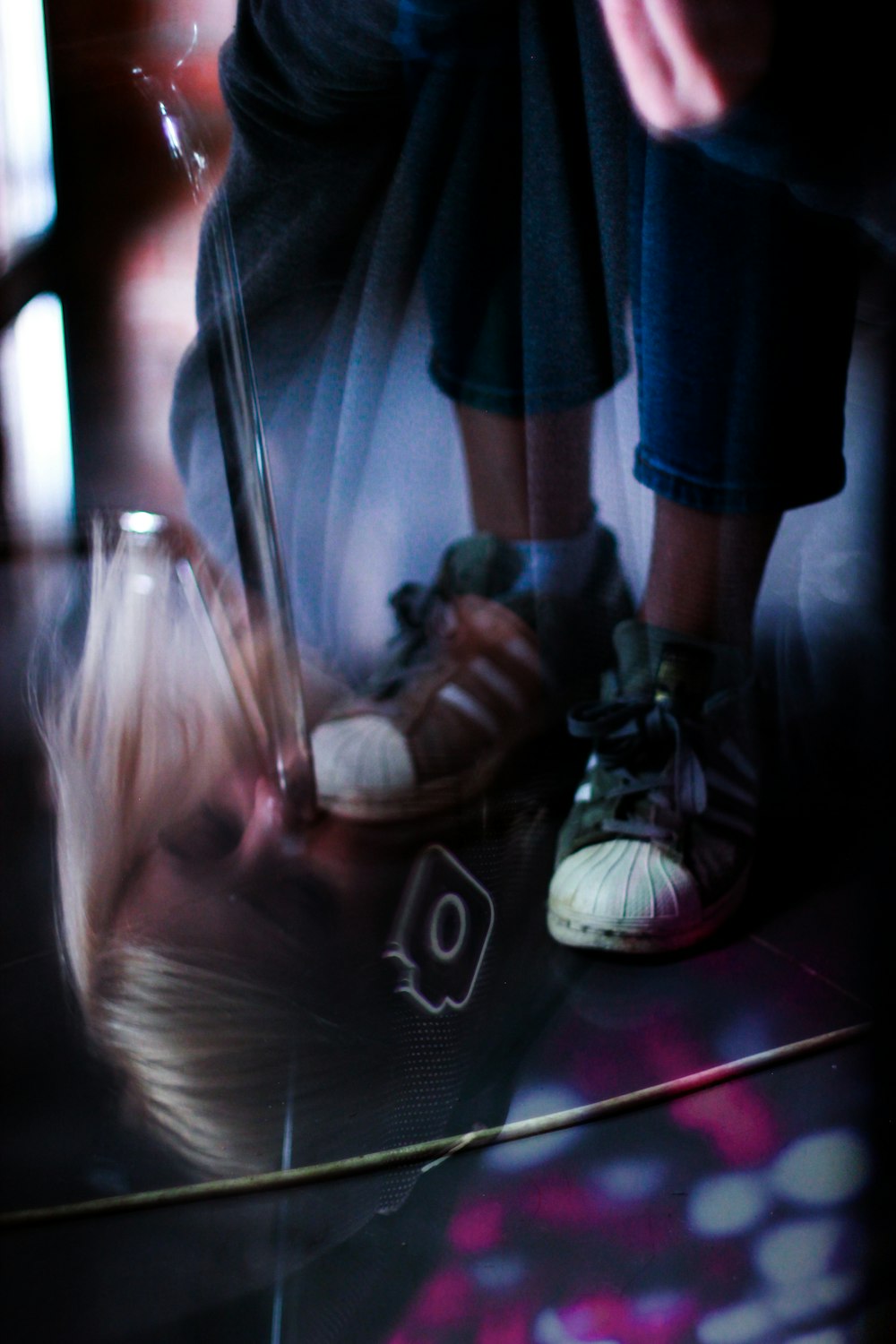 a person standing on a floor with a umbrella