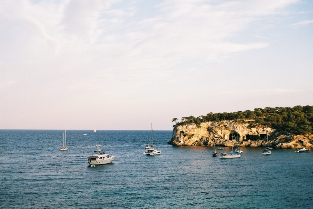 boats on sea viewing island