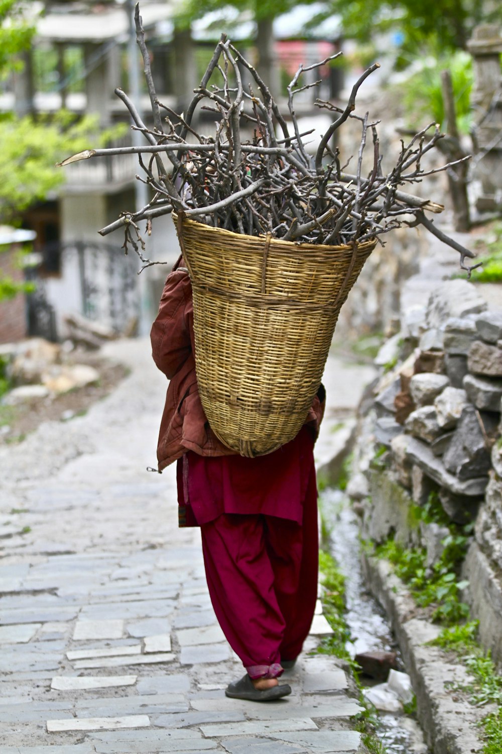 person carrying brown basket