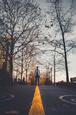 perspective and angle for photo composition,how to photograph late fall vibes; man standing on the street