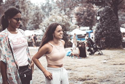 A casual scene of women wearing flats in a park.