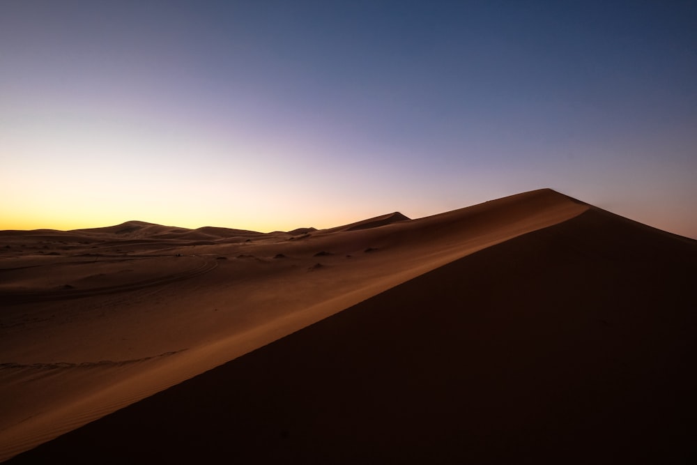 brown desert under blue sky