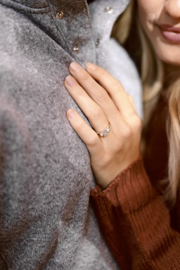 the ring,how to photograph woman leaning on person in gray top