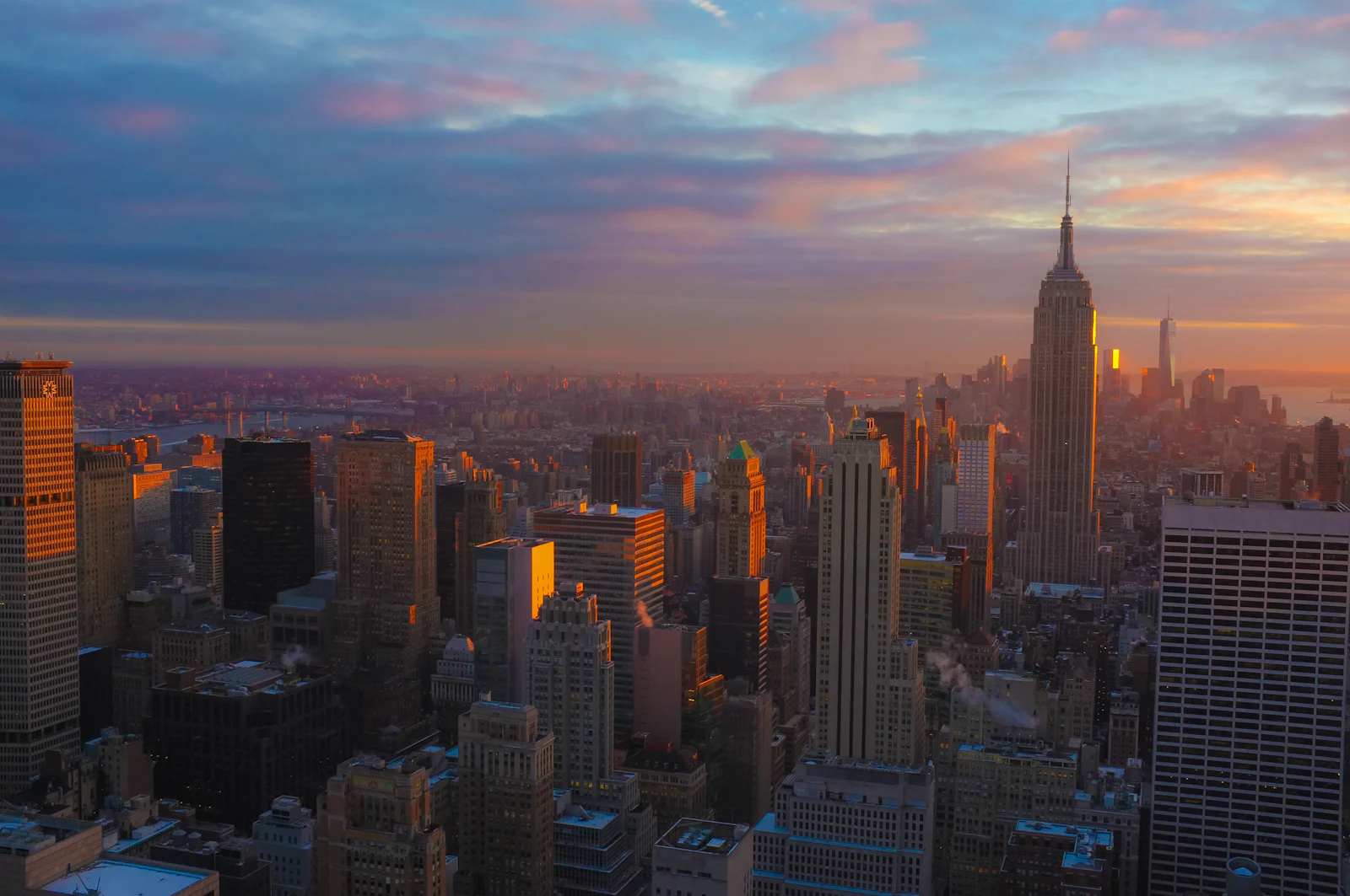 Manhattan skyline and the Empire State Building at sunset