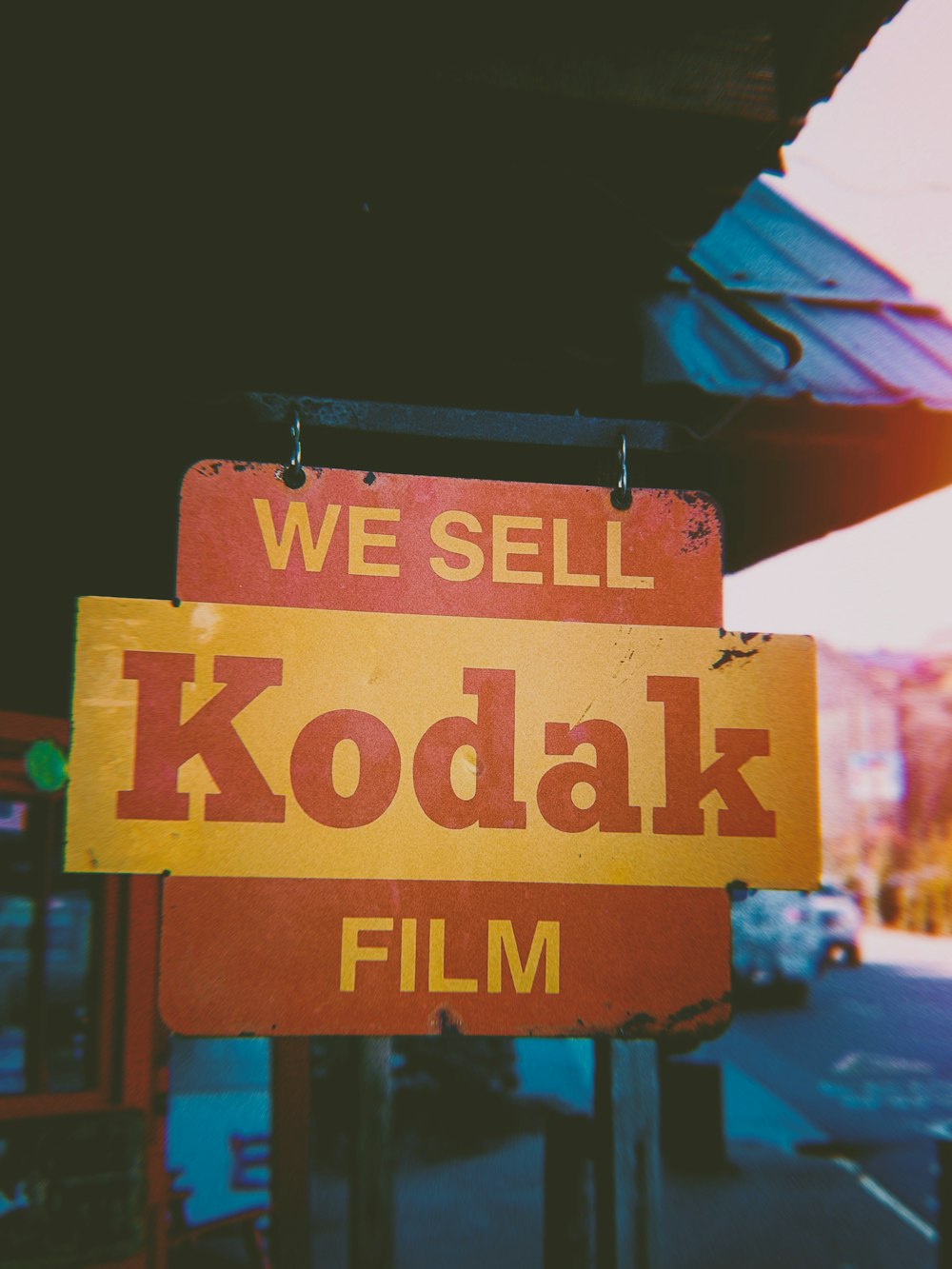 selective focus photography of we sell kodak film signage