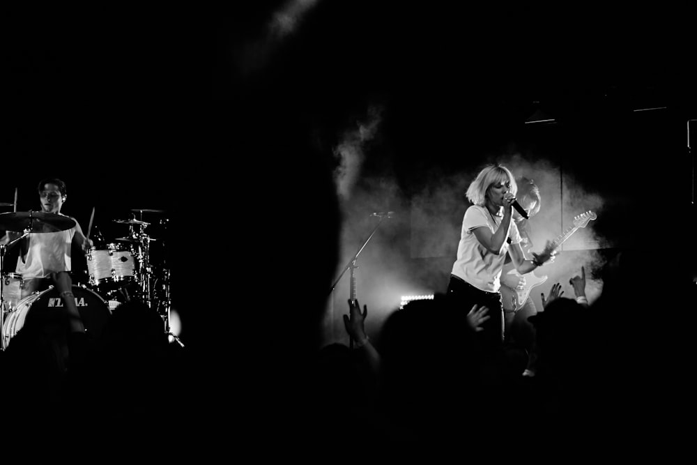 woman holding microphone on stage