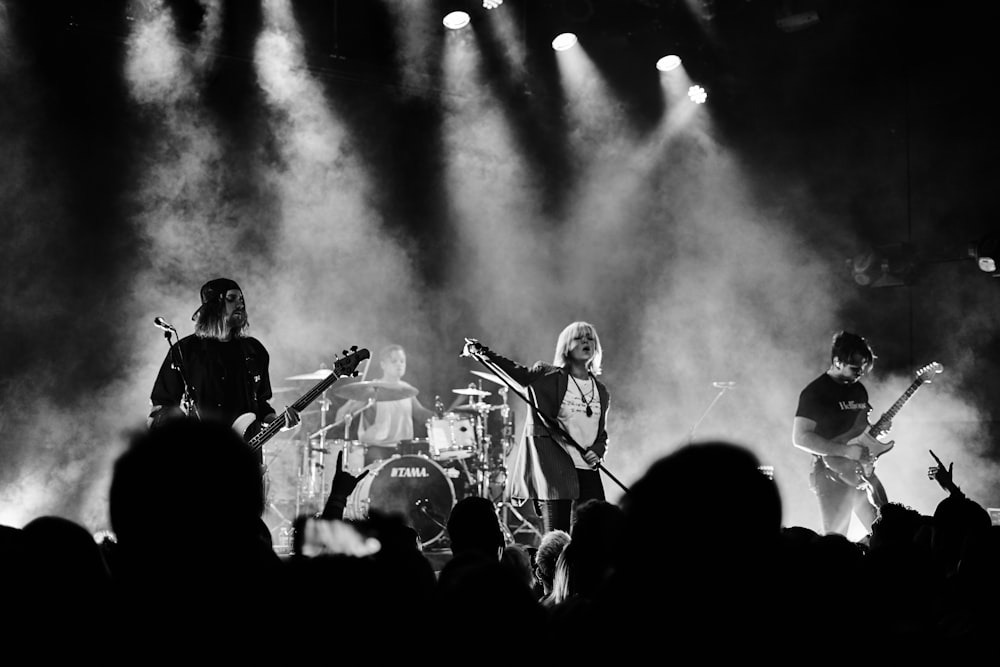 men playing musical instruments on stage