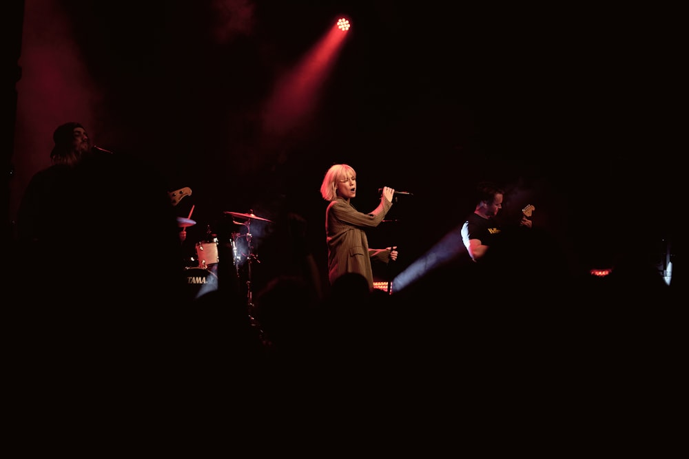 woman holding microphone