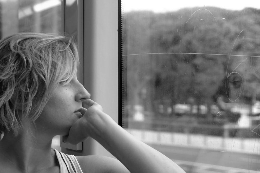 woman looking at window