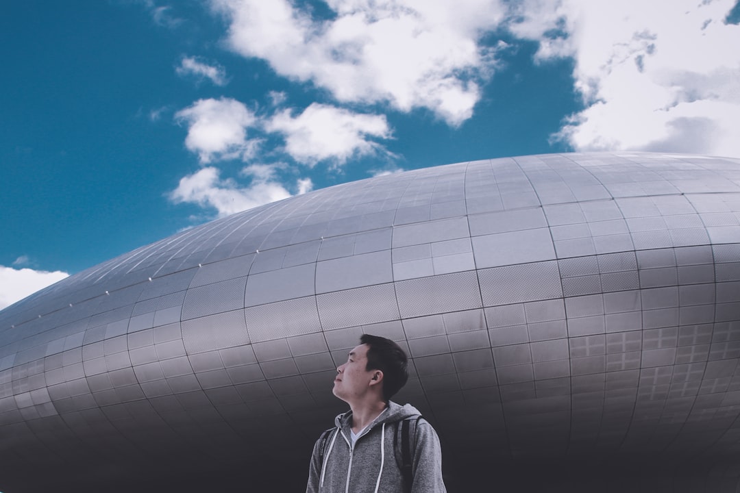 man standing near building